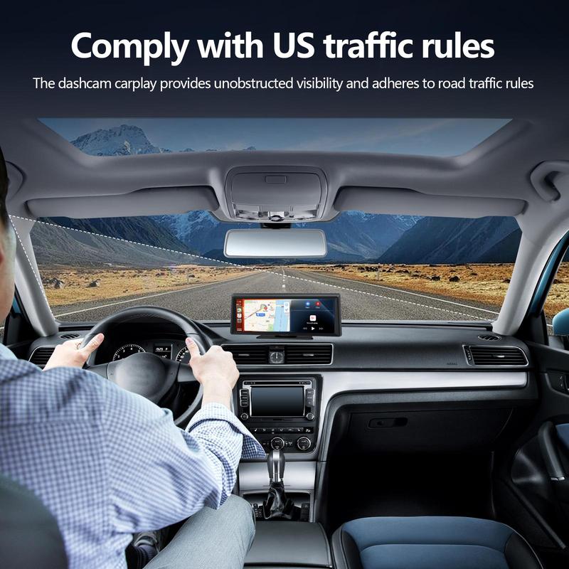 Car interior with dashboard camera and GPS, driving on a road with mountains in the background.