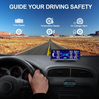 Car dashboard with a digital thermometer and pressure gauge displaying weather information, set against a scenic road backdrop.